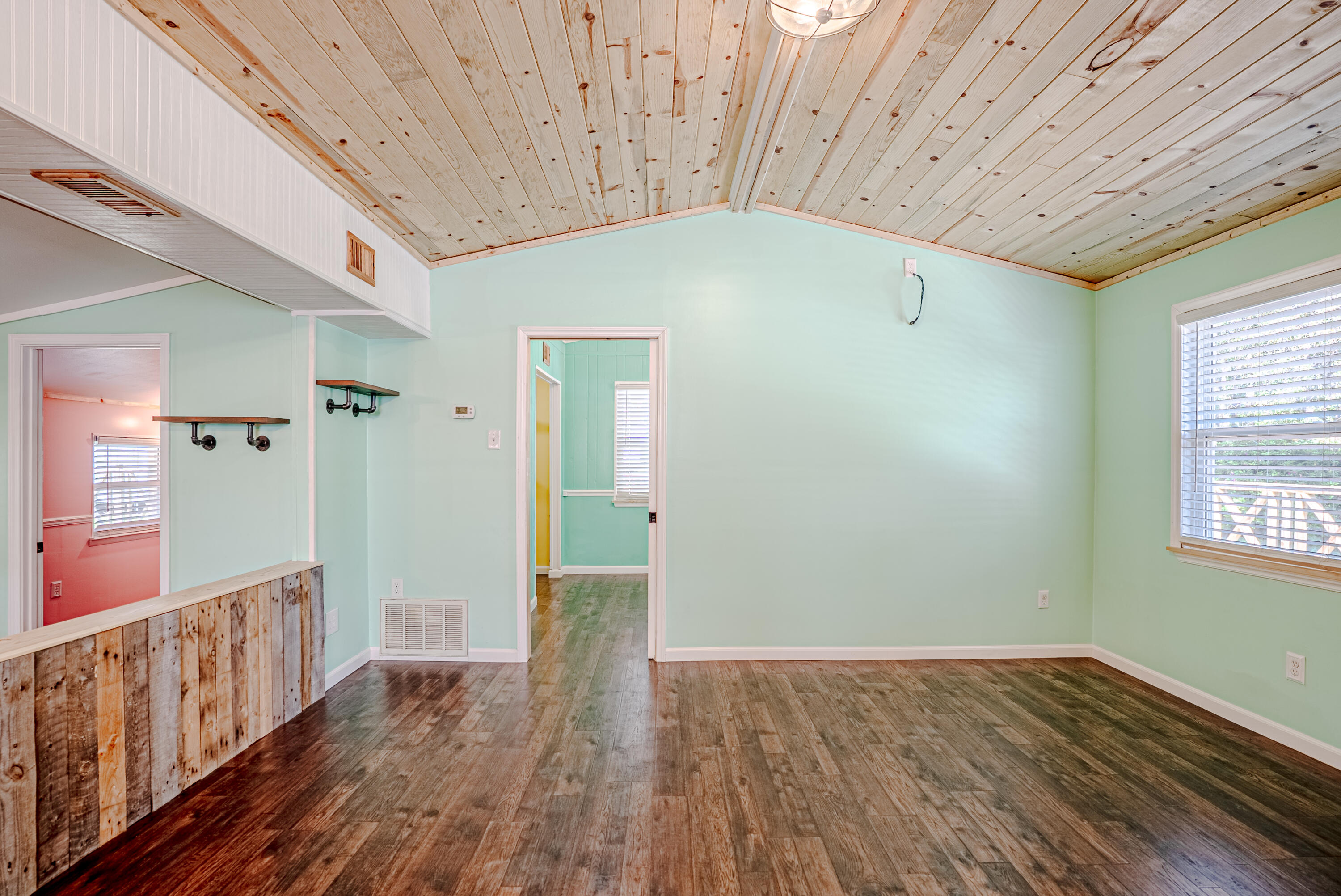 85 Our Street Vernon, FL 32462 - Photo 6 of 66 a view of an empty room with wooden floor
