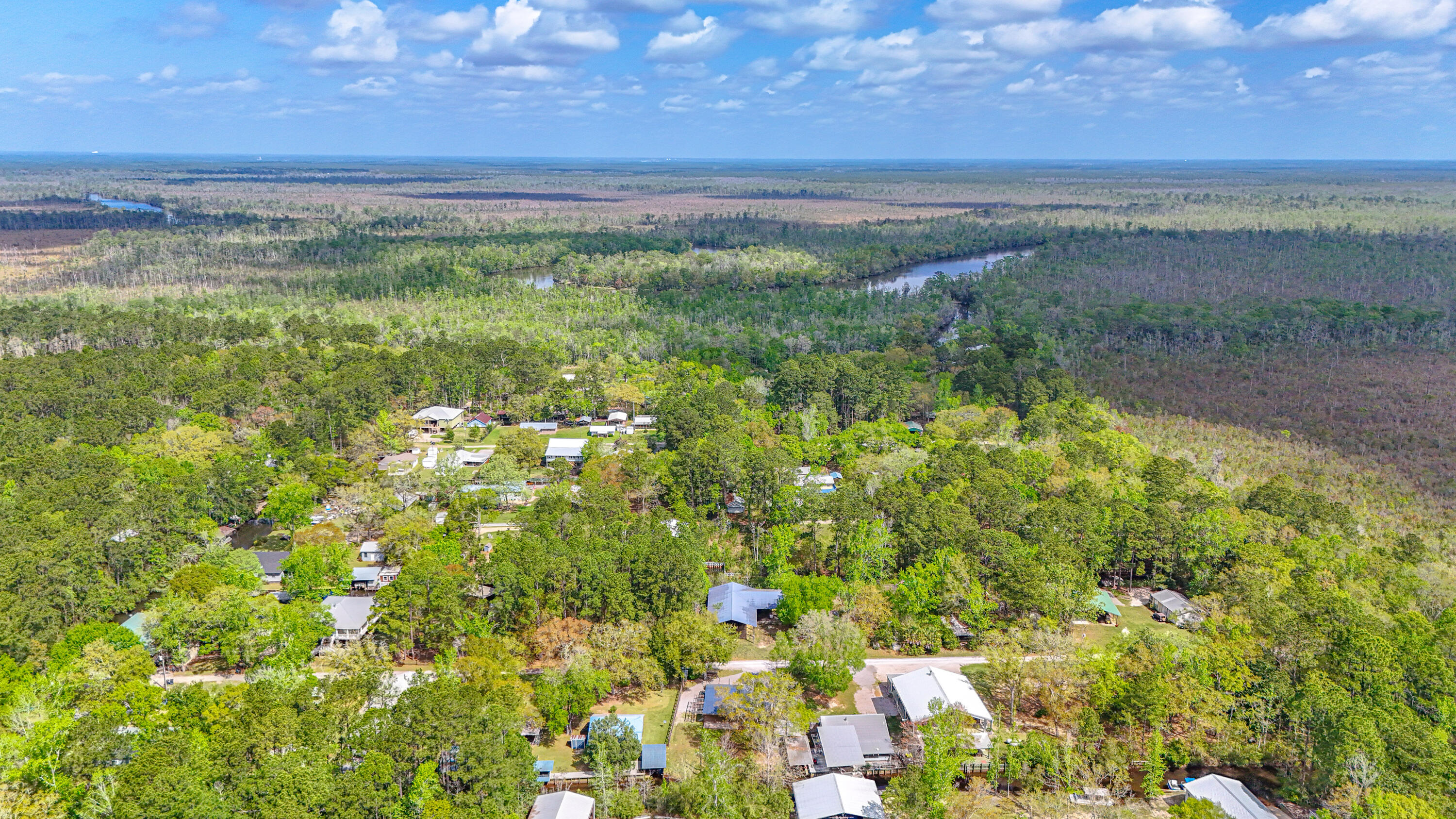 85 Our Street Vernon, FL 32462 - Photo 62 of 66 a view of a field with an ocean