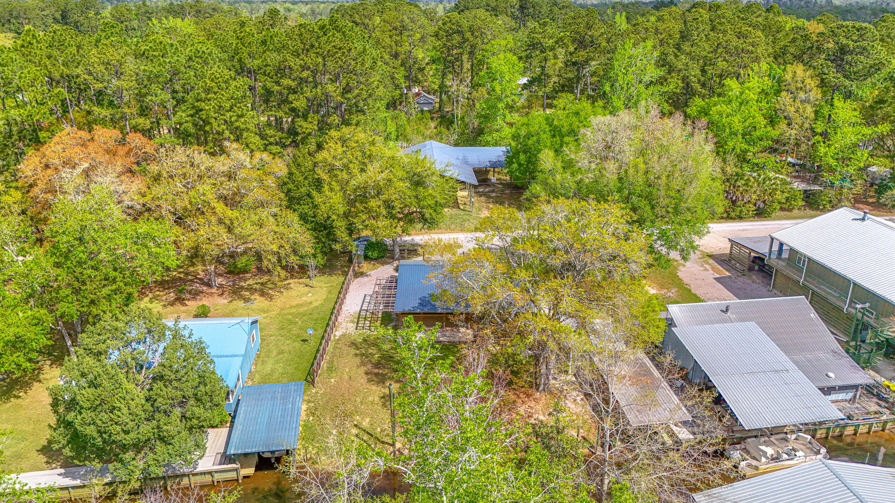85 Our Street Vernon, FL 32462 - Photo 63 of 66 an aerial view of residential houses with yard