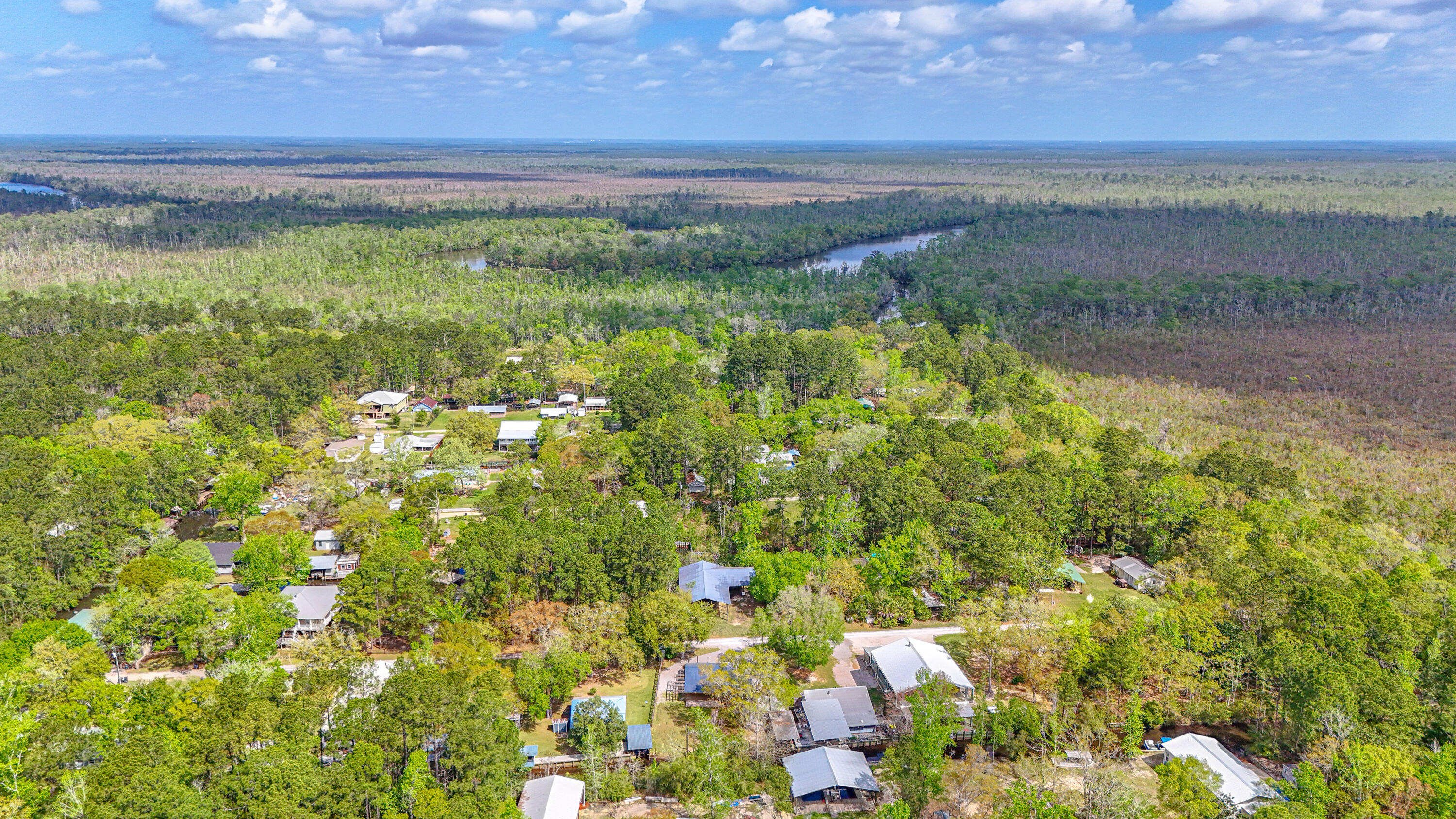 85 Our Street Vernon, FL 32462 - Photo 64 of 66 a view of a lake with a yard