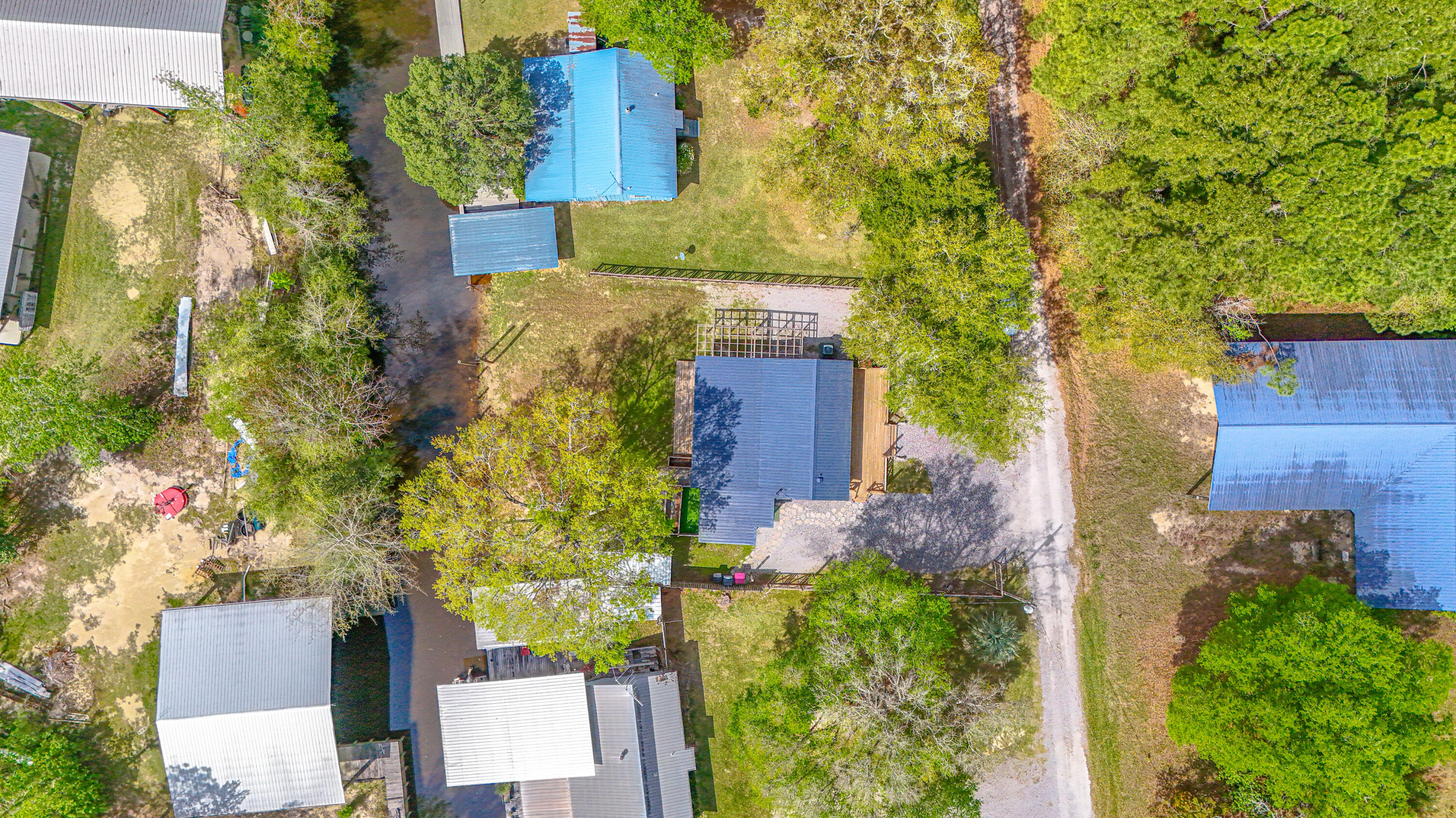 85 Our Street Vernon, FL 32462 - Photo 65 of 66 an aerial view of a house with a yard