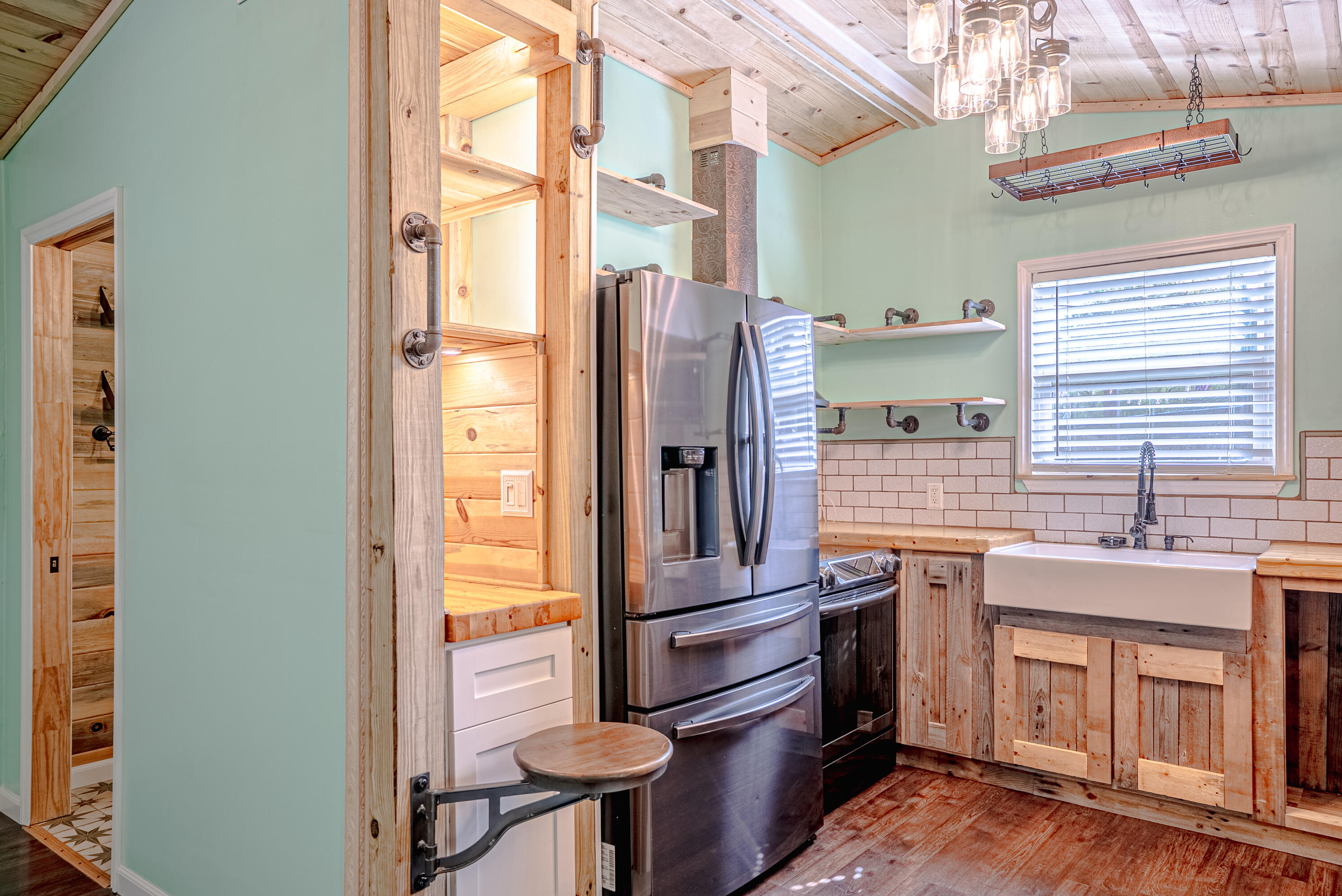 85 Our Street Vernon, FL 32462 - Photo 7 of 66 a kitchen with stainless steel appliances granite countertop a refrigerator and a sink