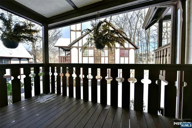 a view of wooden house with a large window
