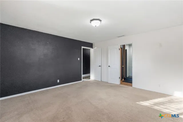 a bathroom with a double vanity sink mirror and toilet