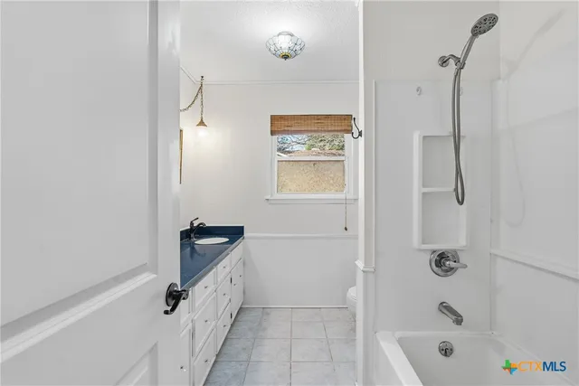 a view of a bedroom with a chandelier