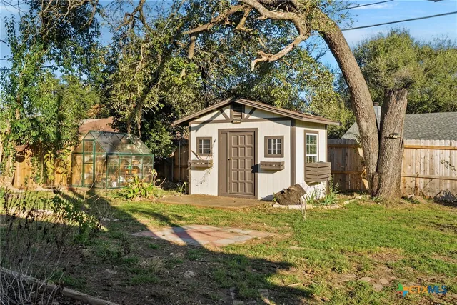 a house that has tree in front of it