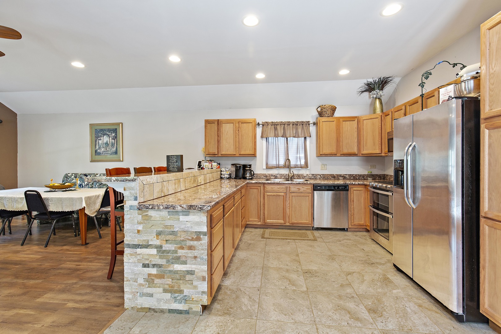 114 Deerpath Road Lake In The Hills, IL 60156 - Photo 4 of 15 a large kitchen with stainless steel appliances lots of counter space and a refrigerator