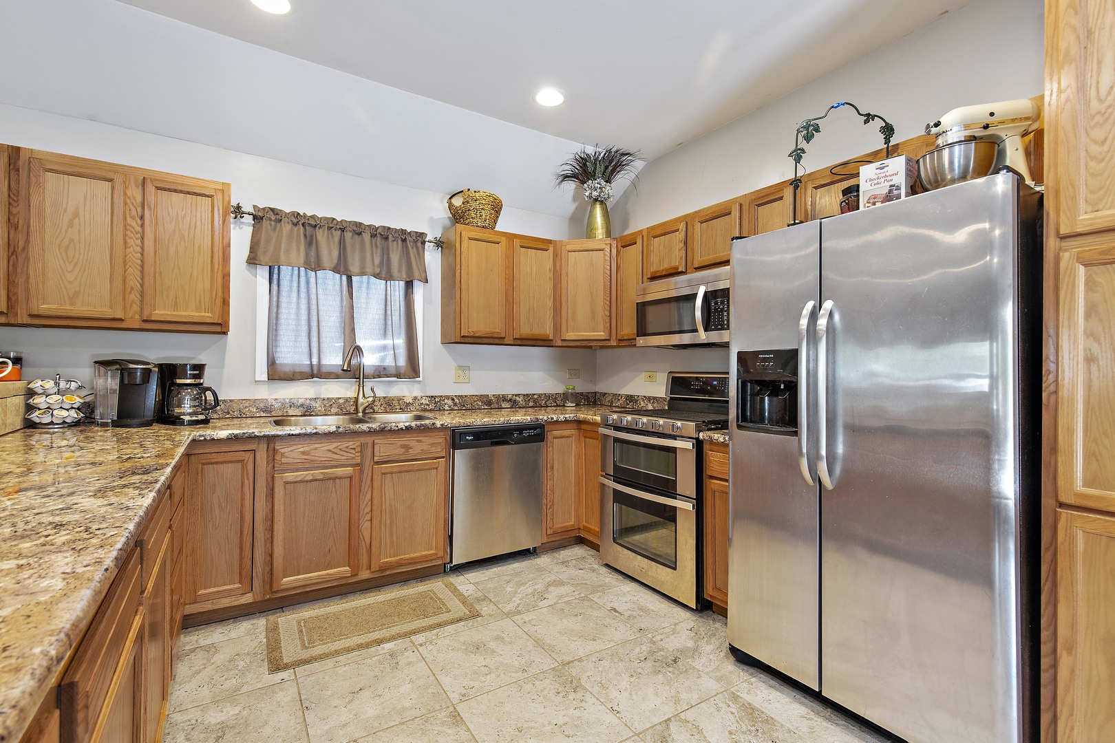 114 Deerpath Road Lake In The Hills, IL 60156 - Photo 5 of 15 a kitchen with stainless steel appliances granite countertop a refrigerator a stove and a sink