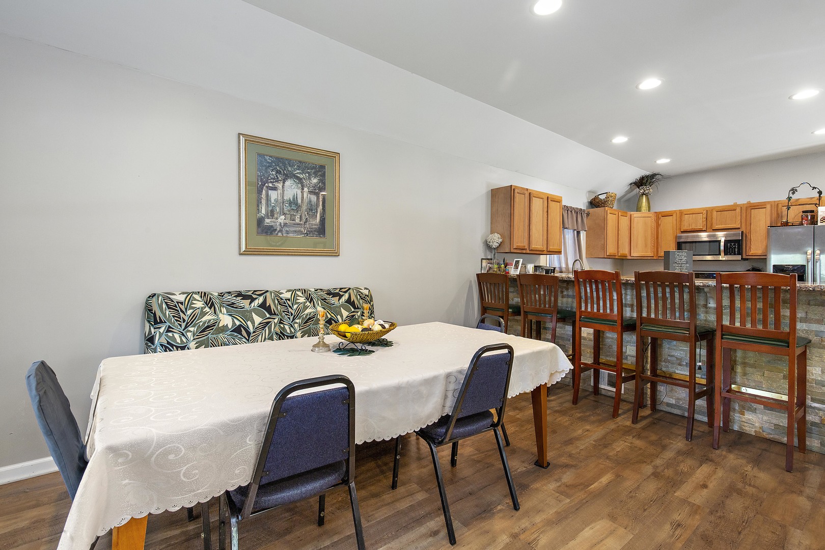 114 Deerpath Road Lake In The Hills, IL 60156 - Photo 8 of 15 a view of a dining room with furniture and chandelier