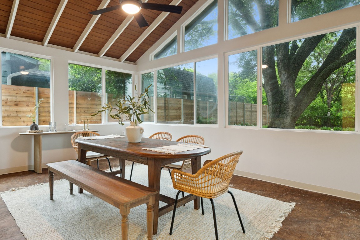 a view of a patio with a dining table and chairs