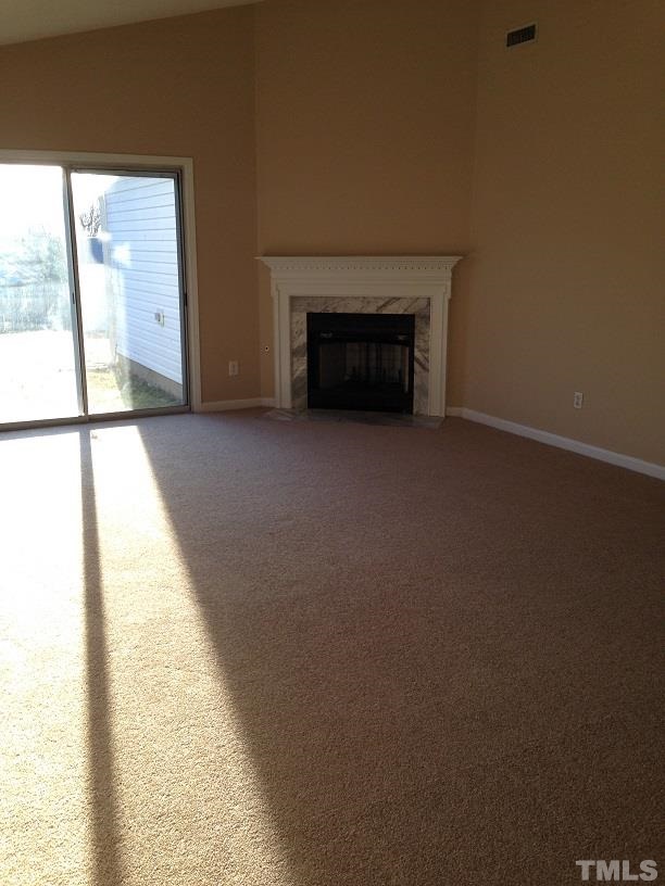 4625 Silverdene Street Raleigh, NC 27616 - Photo 3 of 3 a view of an empty room with a fireplace
