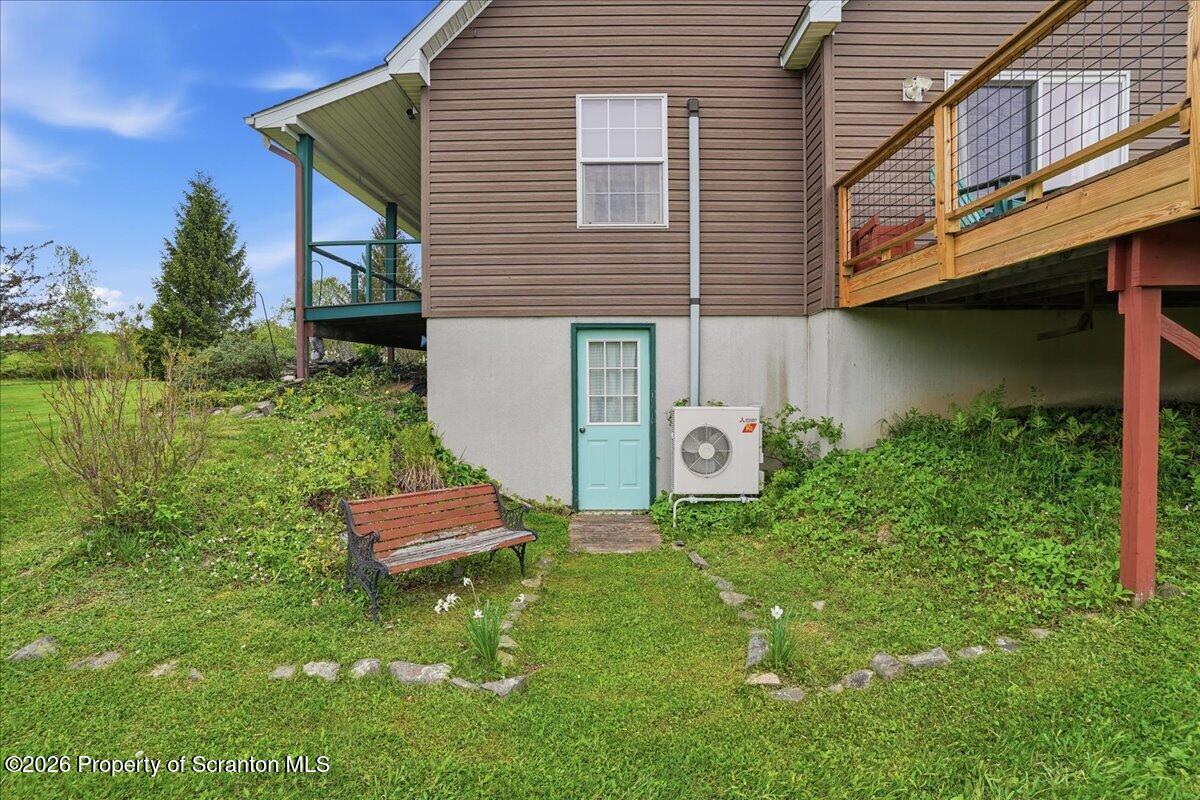 5231 Fiddle Lake Road Thompson, PA 18465 - Photo 22 of 34 a front view of a house with garden