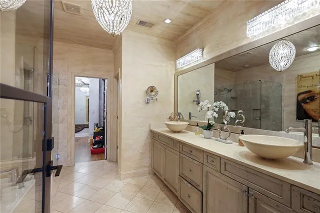 a living room with furniture a flat screen tv and a window