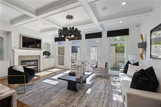 a living room with furniture fireplace and flat screen tv
