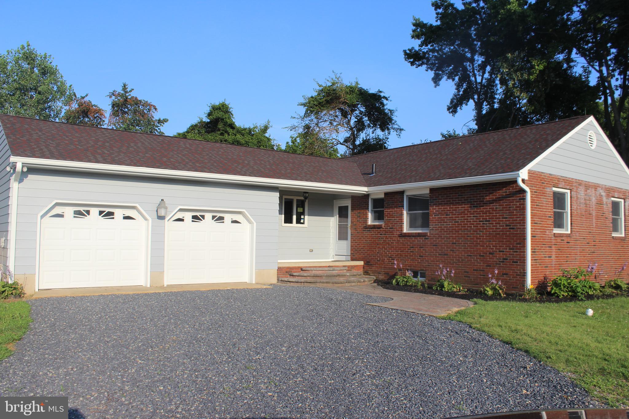 front view of a house with a small yard
