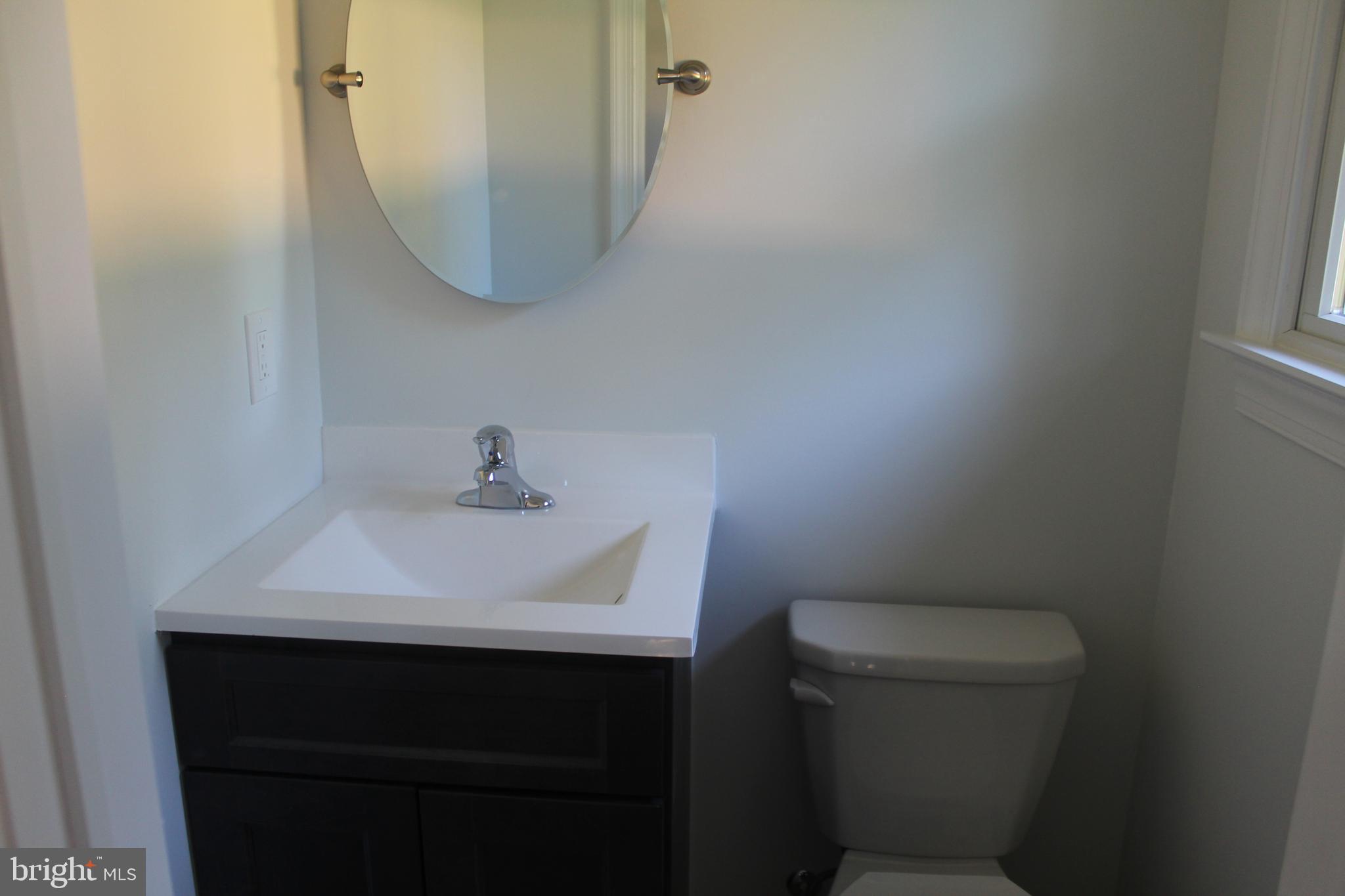 3128 Highway 206 Columbus, NJ 08022 - Photo 11 of 14 a bathroom with a sink toilet and mirror