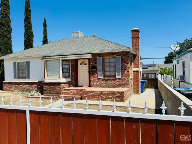 a front view of a house with large windows