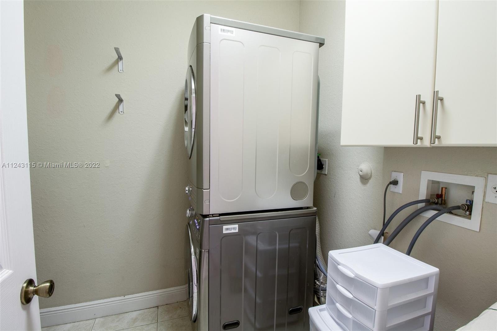 22737 Southwest 89th Path Cutler Bay, FL 33190 - Photo 13 of 27 a bathroom with a sink a toilet and shower