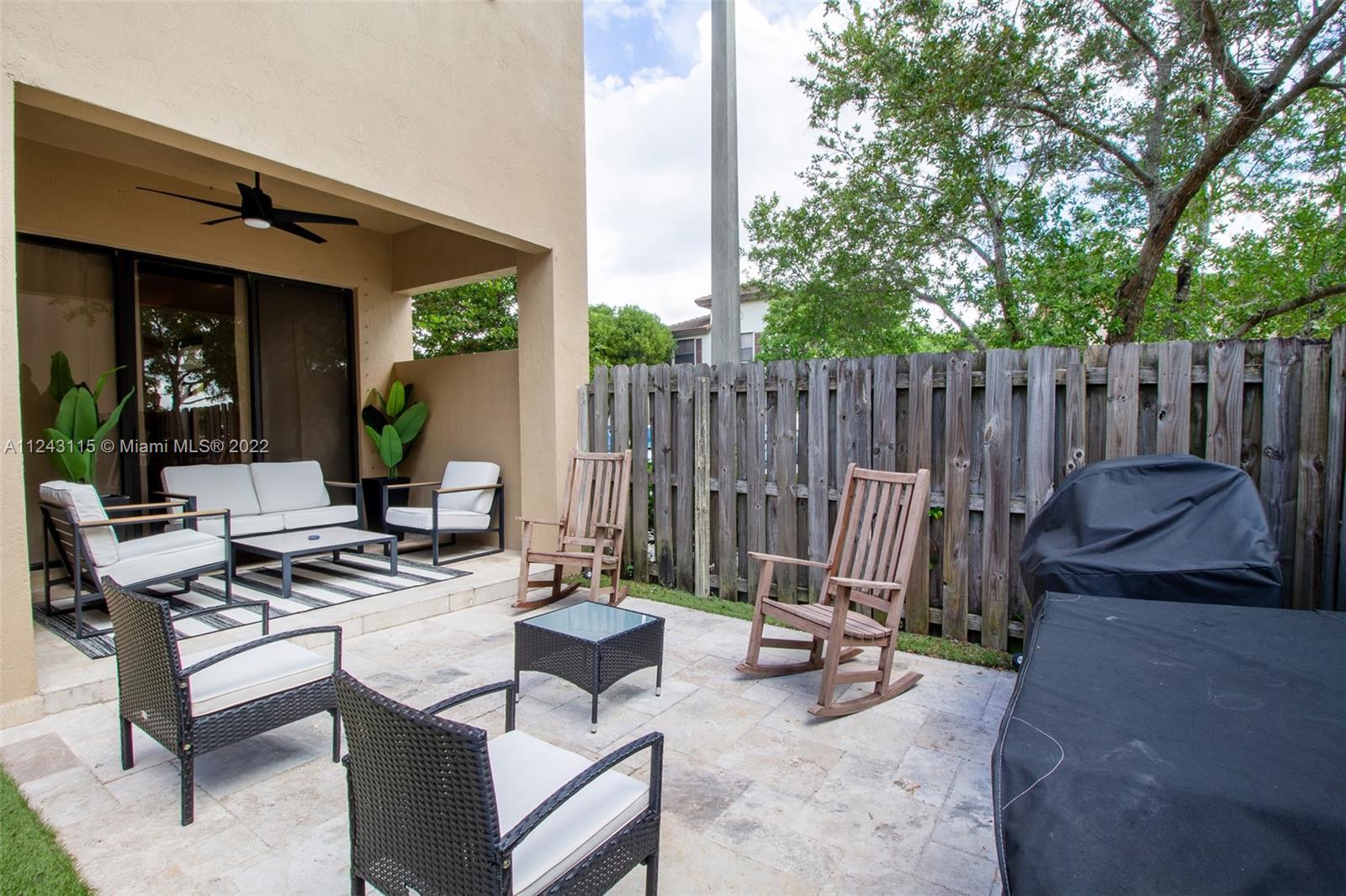 22737 Southwest 89th Path Cutler Bay, FL 33190 - Photo 21 of 27 a view of a chairs and table in the patio