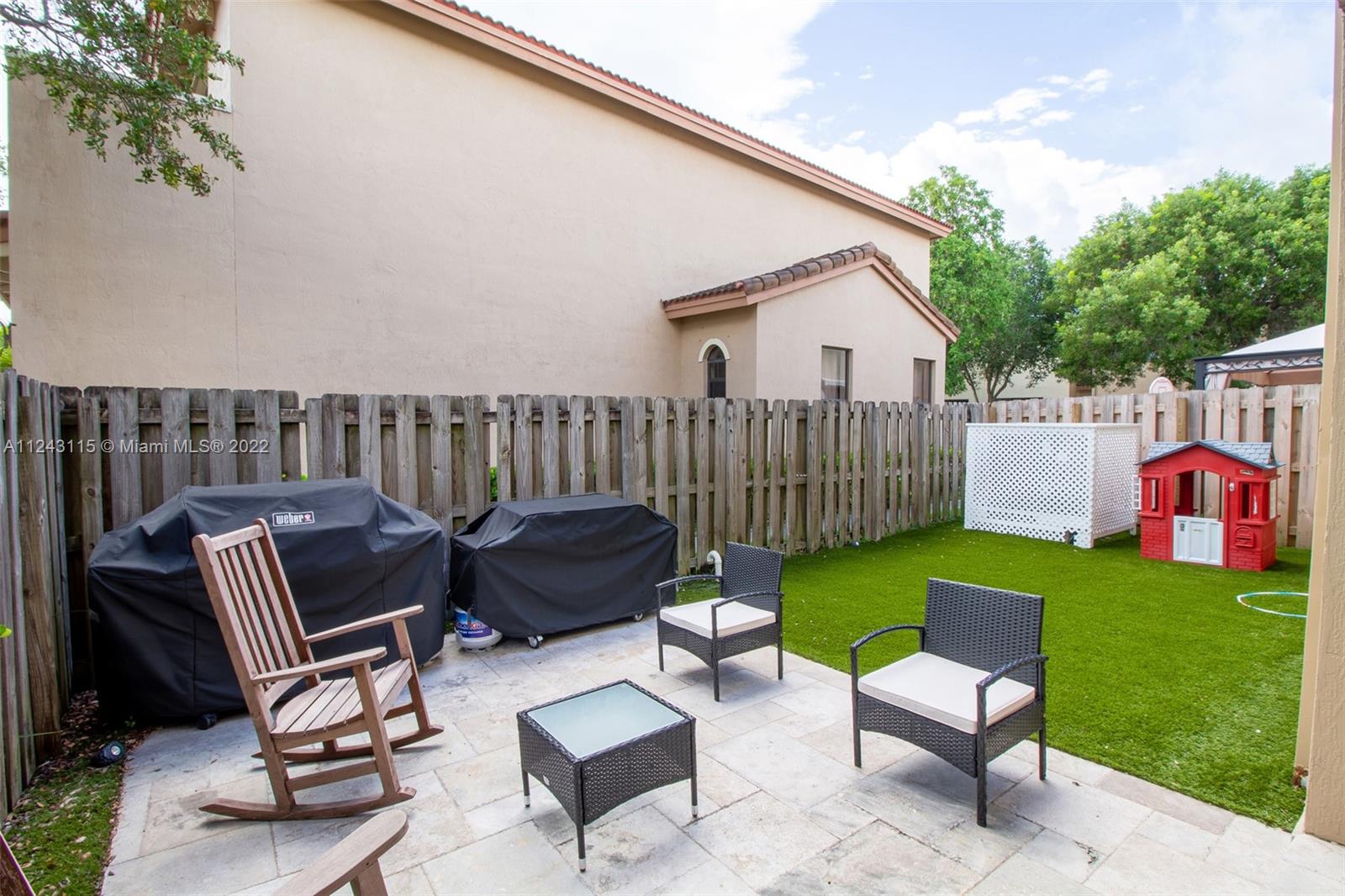 22737 Southwest 89th Path Cutler Bay, FL 33190 - Photo 22 of 27 a view of a patio with a yard