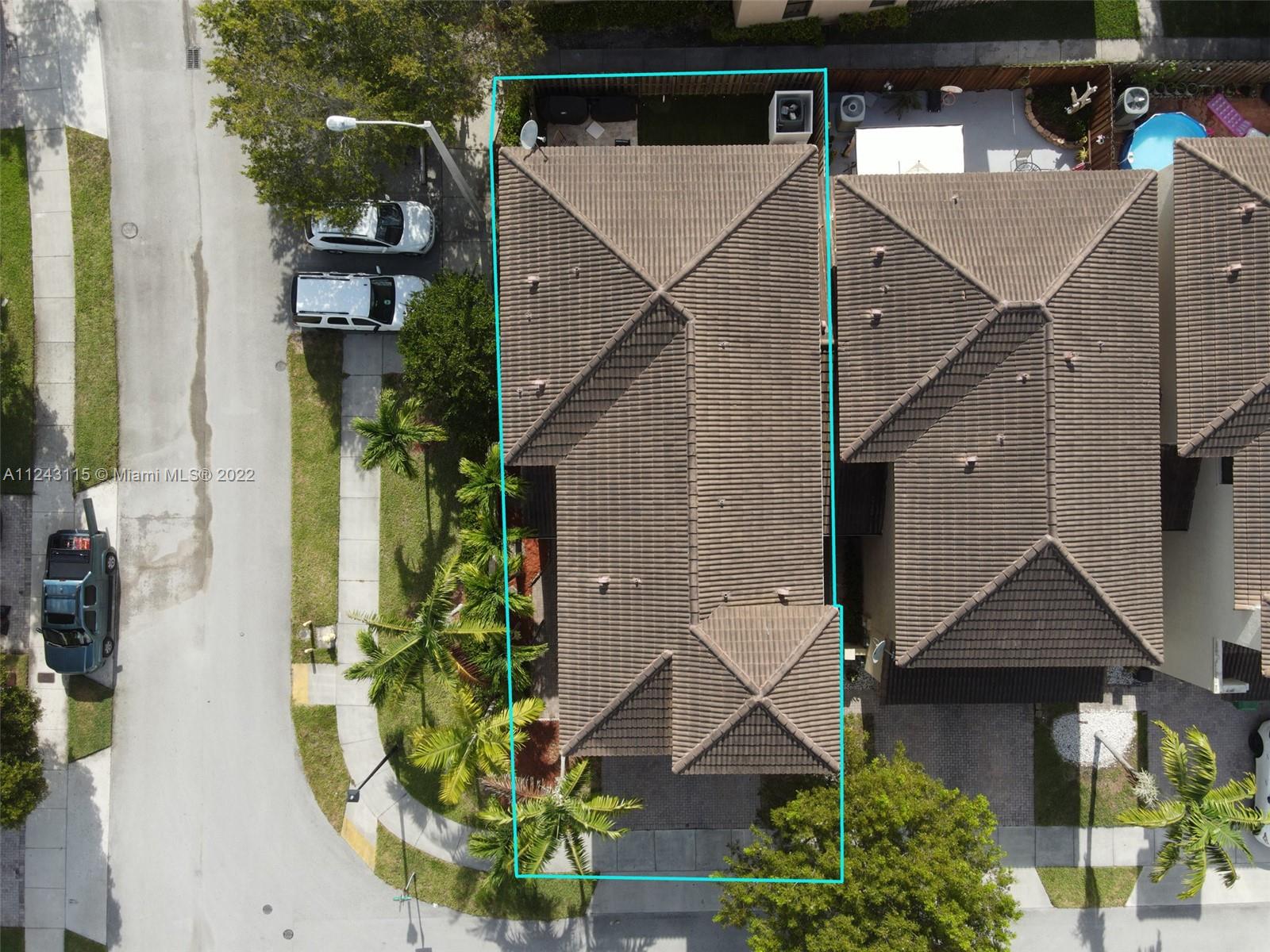 22737 Southwest 89th Path Cutler Bay, FL 33190 - Photo 25 of 27 a front view of a house with a yard