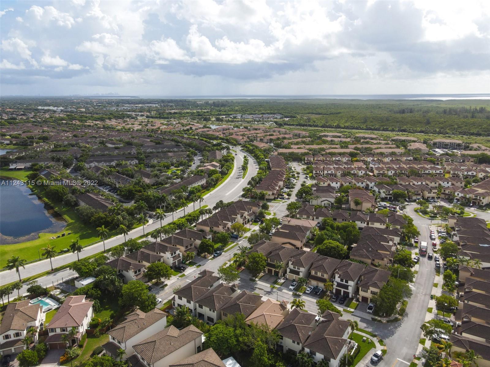22737 Southwest 89th Path Cutler Bay, FL 33190 - Photo 26 of 27 an aerial view of residential building and lake
