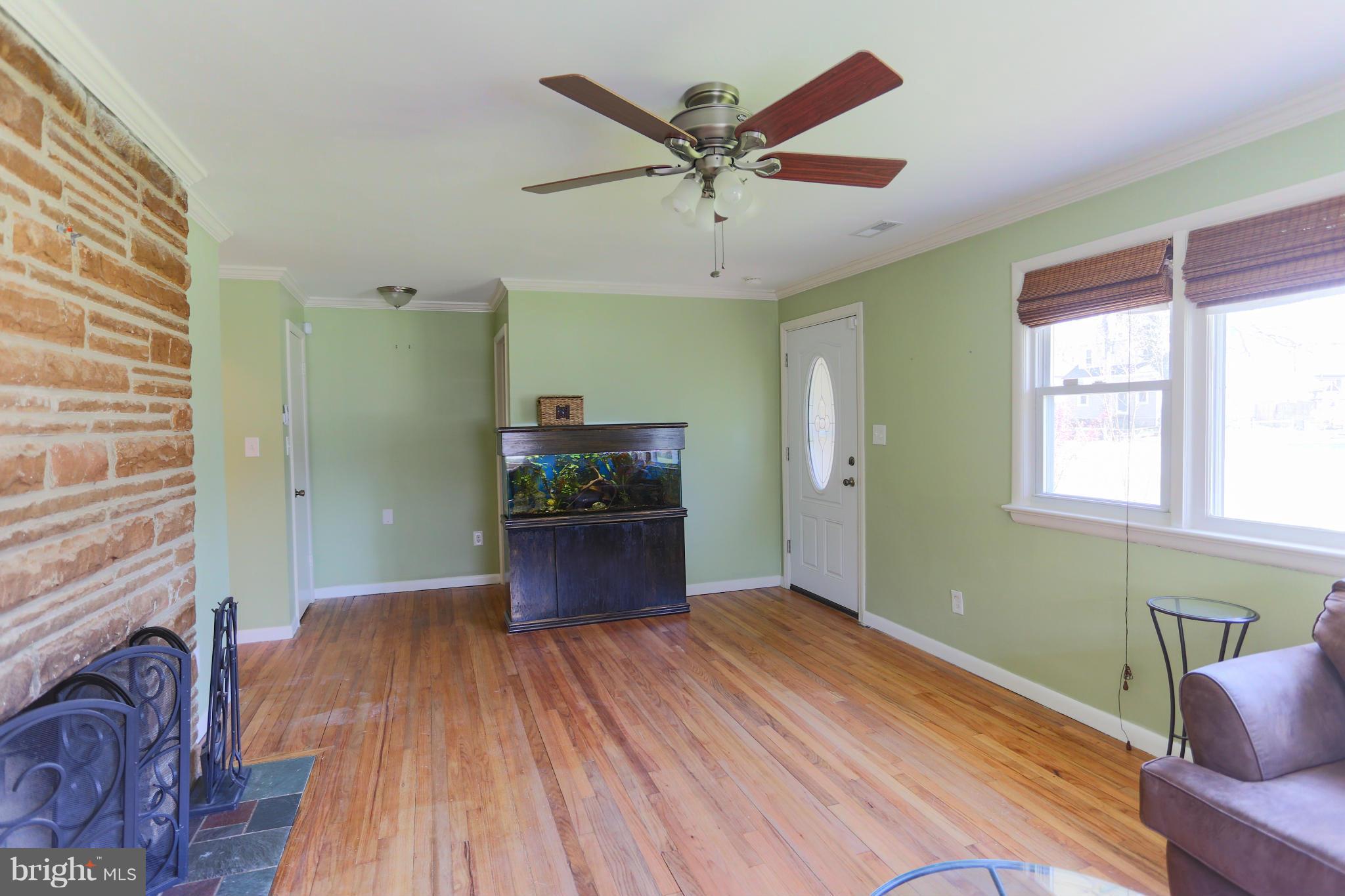 632 Londontown Road Edgewater, MD 21037 - Photo 14 of 28 a room with wooden floor and windows
