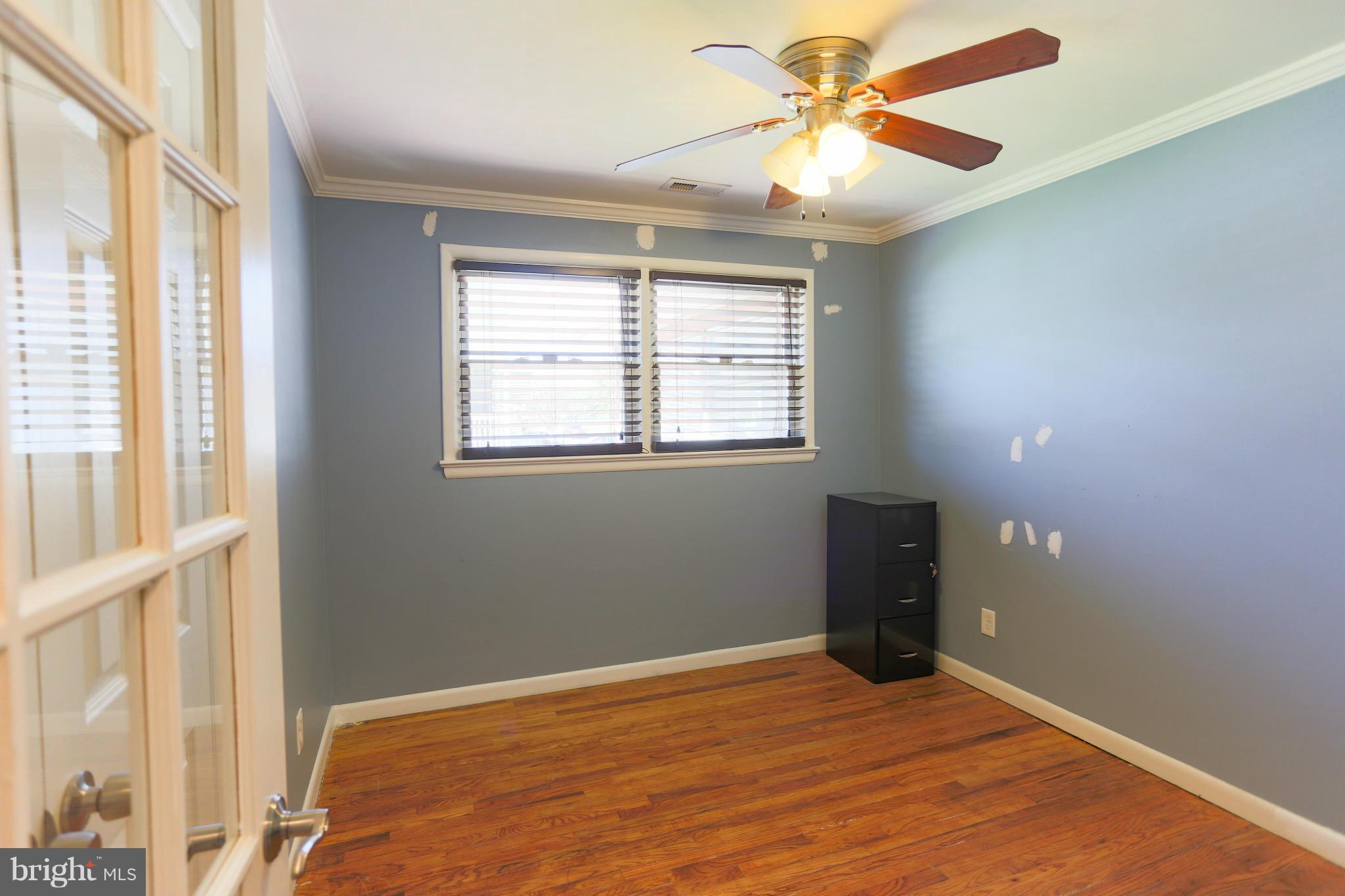 632 Londontown Road Edgewater, MD 21037 - Photo 16 of 28 a view of an empty room with a window and a ceiling fan