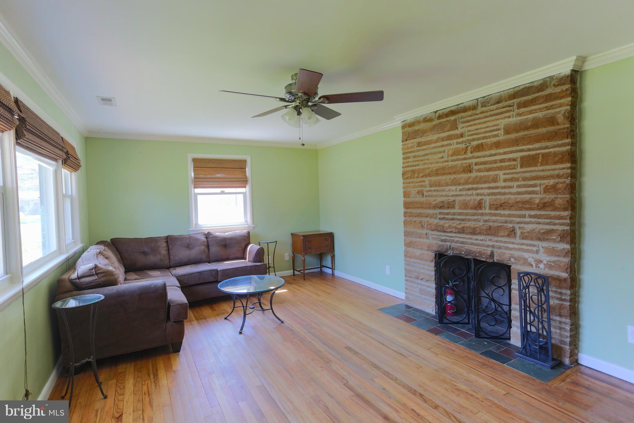 632 Londontown Road Edgewater, MD 21037 - Photo 3 of 28 a living room with furniture and a fireplace