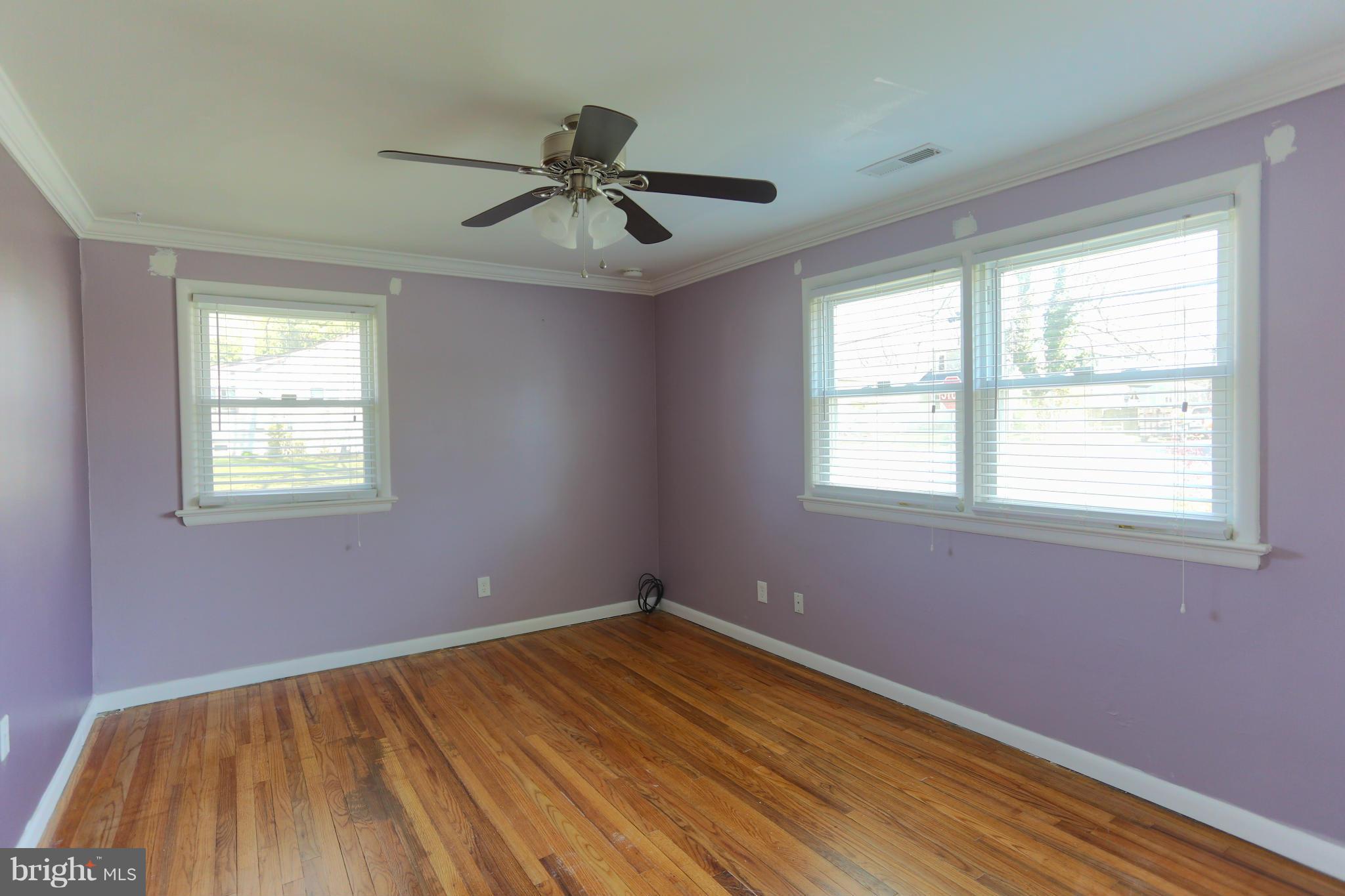 632 Londontown Road Edgewater, MD 21037 - Photo 8 of 28 a view of empty room with wooden floor and fan