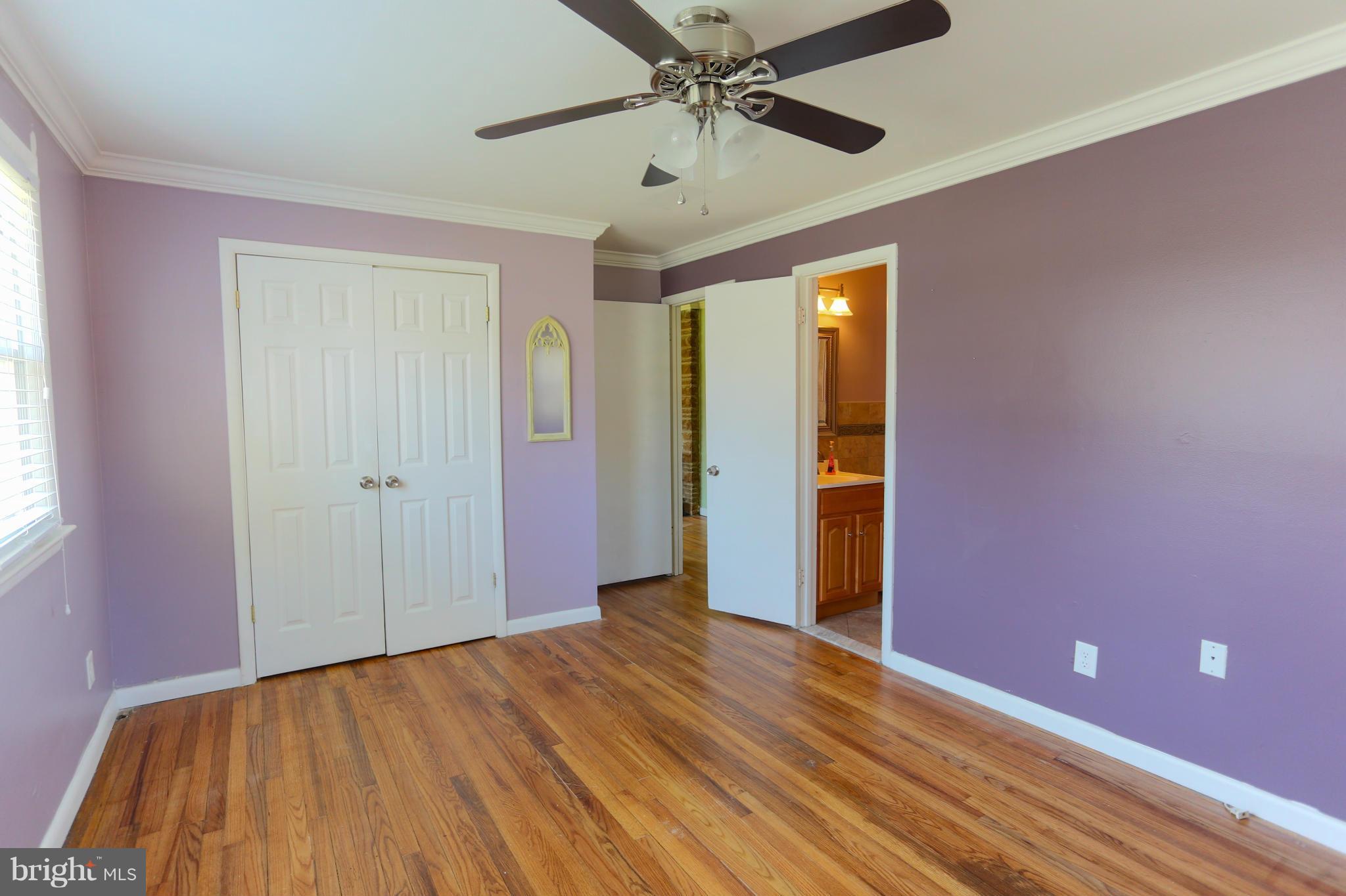632 Londontown Road Edgewater, MD 21037 - Photo 9 of 28 a view of empty room with wooden floor and fan