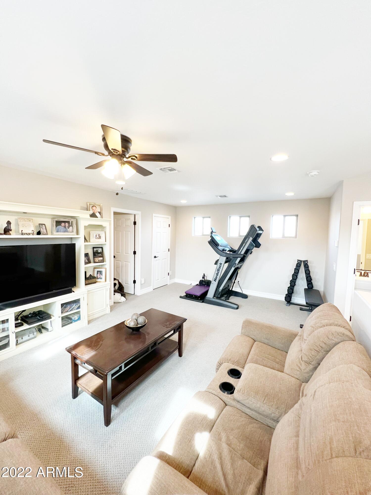3330 West Fremont Rd. Phoenix, AZ 85041 - Photo 24 of 43 a living room with furniture and a flat screen tv