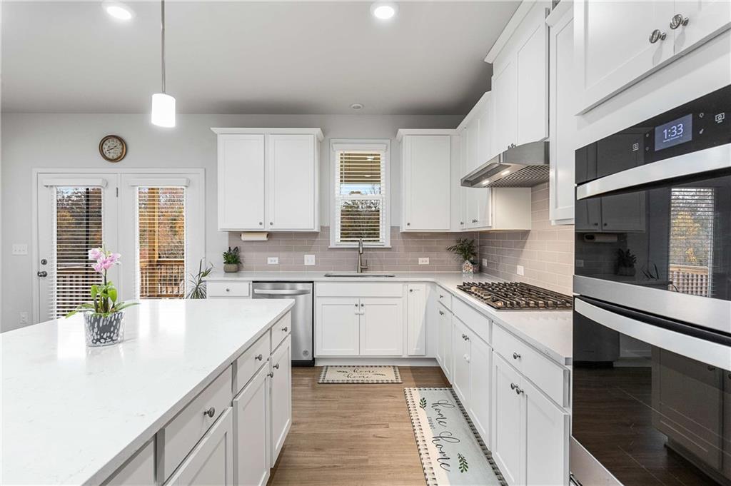 162 Carmichael Drive Canton, GA 30115 - Photo 12 of 57 a kitchen with a sink stove and cabinets