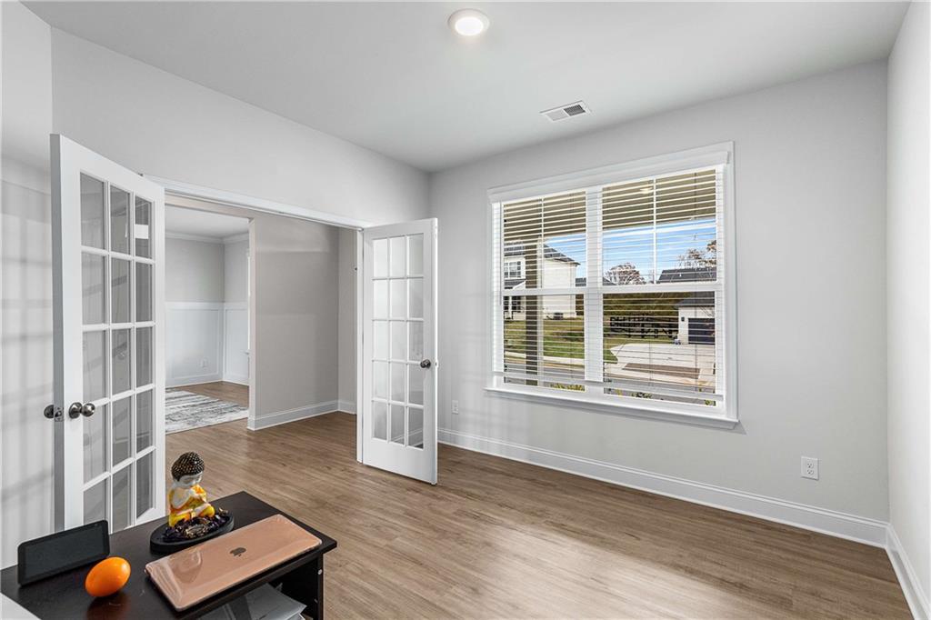 162 Carmichael Drive Canton, GA 30115 - Photo 19 of 57 a living room with hard wood floors and a window