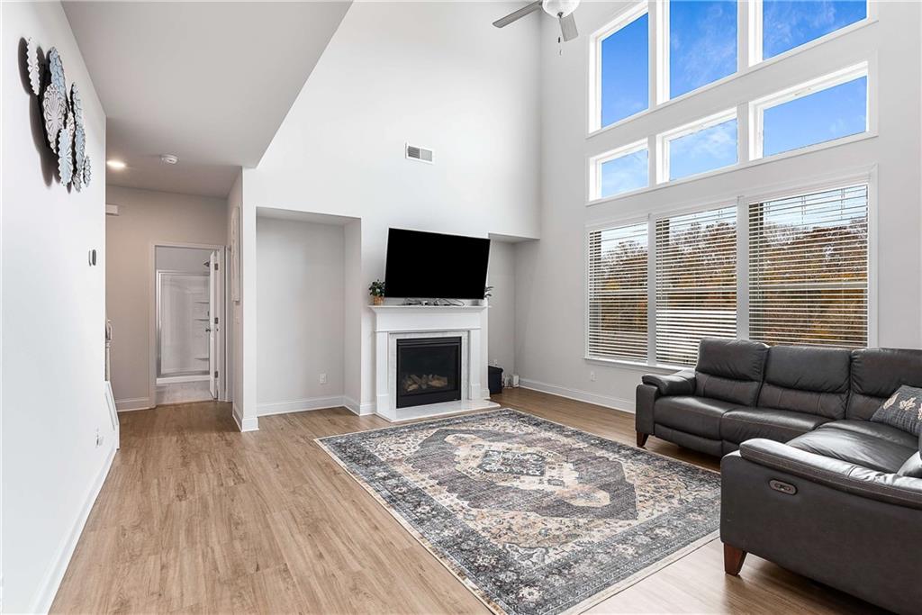 162 Carmichael Drive Canton, GA 30115 - Photo 26 of 57 a living room with furniture windows and a fireplace