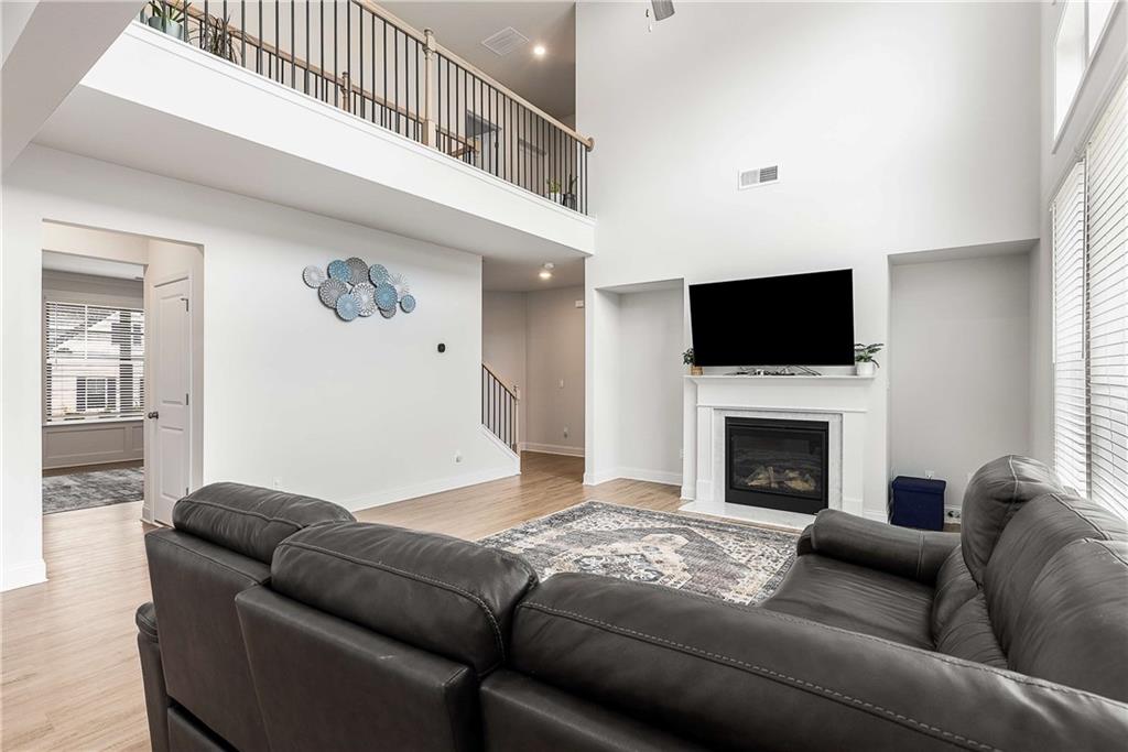 162 Carmichael Drive Canton, GA 30115 - Photo 28 of 57 a living room with furniture or fireplace and a flat screen tv