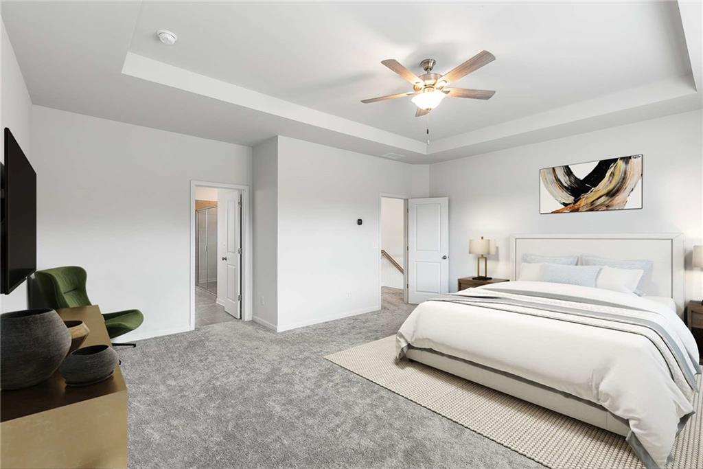 162 Carmichael Drive Canton, GA 30115 - Photo 29 of 57 a bedroom with a large bed and a ceiling fan