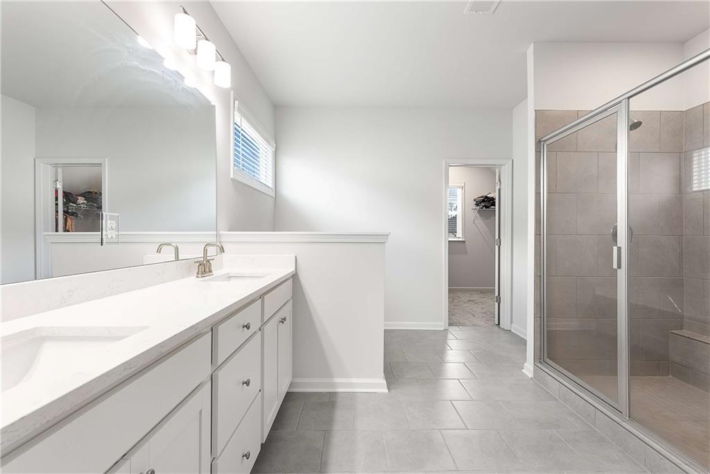 162 Carmichael Drive Canton, GA 30115 - Photo 32 of 57 a spacious bathroom with a shower sink and mirror