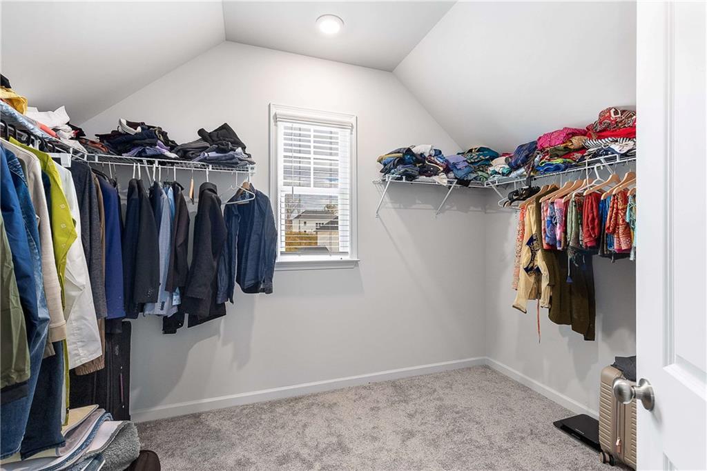 162 Carmichael Drive Canton, GA 30115 - Photo 36 of 57 a view of walk in closet with clothes and shoes
