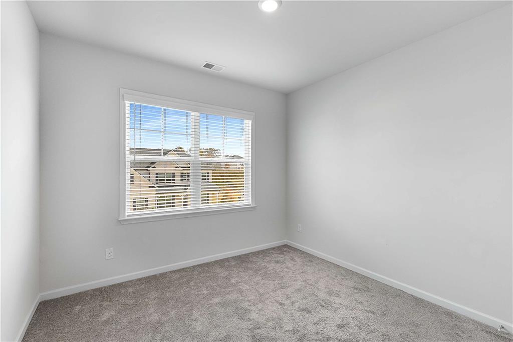 162 Carmichael Drive Canton, GA 30115 - Photo 43 of 57 an empty room with a window