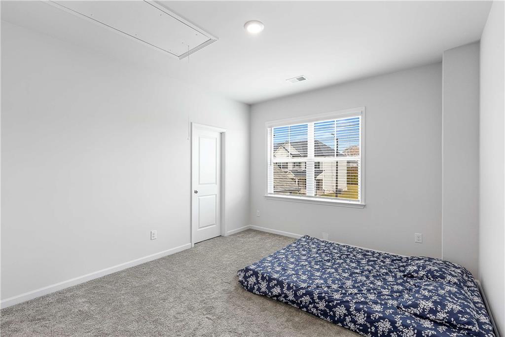 162 Carmichael Drive Canton, GA 30115 - Photo 45 of 57 a bedroom with a bed and a window