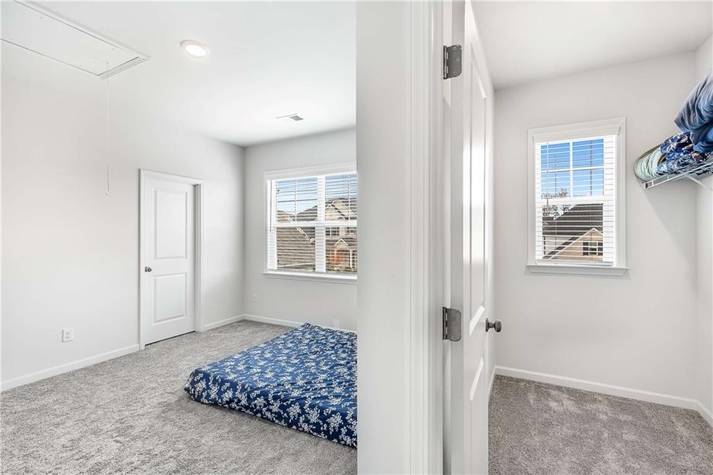 162 Carmichael Drive Canton, GA 30115 - Photo 47 of 57 a bedroom with bed and a window