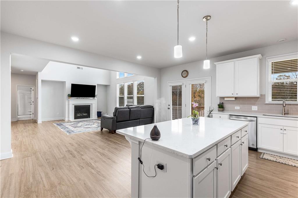 162 Carmichael Drive Canton, GA 30115 - Photo 10 of 57 a kitchen with a stove a sink and a refrigerator