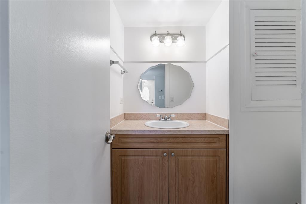 9720 South Hollybrook Lake Drive, Unit 205 Pembroke Pines, FL 33025 - Photo 12 of 57 a bathroom with a sink and a mirror
