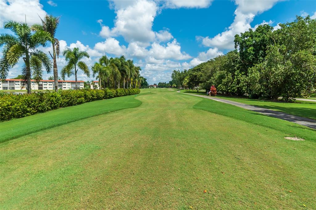 9720 South Hollybrook Lake Drive, Unit 205 Pembroke Pines, FL 33025 - Photo 33 of 57 a view of a field with grass and trees