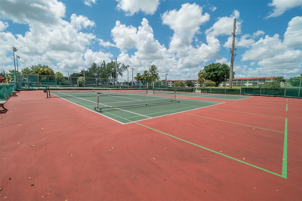 9720 South Hollybrook Lake Drive, Unit 205 Pembroke Pines, FL 33025 - Photo 37 of 57 a view of a tennis court