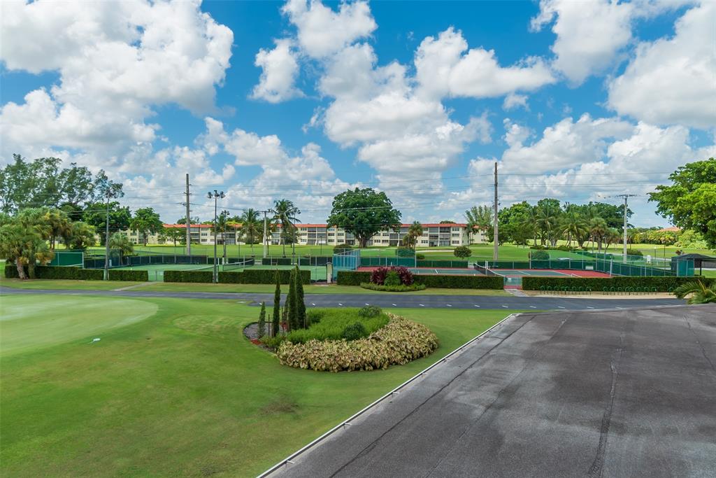 9720 South Hollybrook Lake Drive, Unit 205 Pembroke Pines, FL 33025 - Photo 41 of 57 a view of a golf course with a fountain