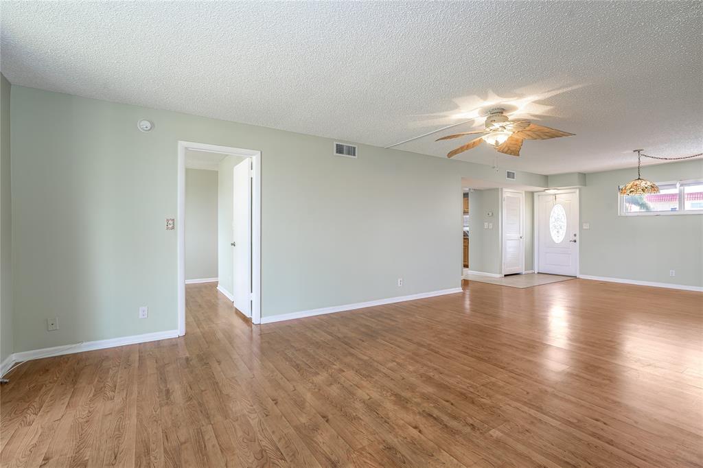 9720 South Hollybrook Lake Drive, Unit 205 Pembroke Pines, FL 33025 - Photo 7 of 57 a view of empty room with wooden floor and fan