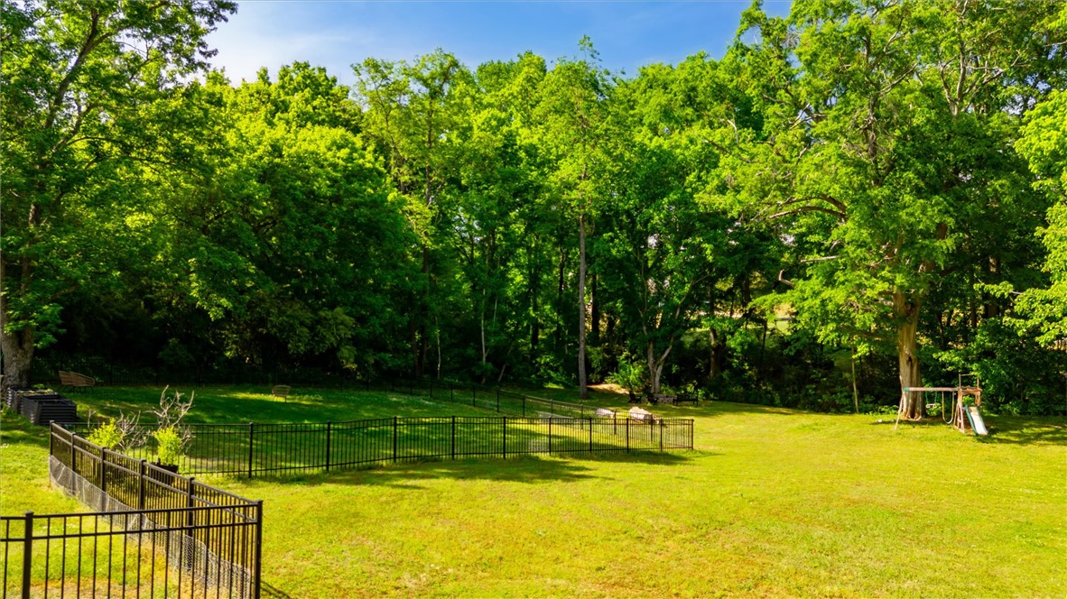 117 Winding Creek Road Anderson, SC 29621 - Photo 38 of 42 Expansive green lawn and mature trees offer a private outdoor sanctuary.