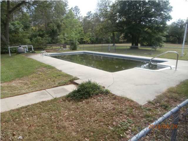 381 Roberts Road East DeFuniak Springs, FL 32433 - Photo 14 of 16 a view of a swimming pool with a yard